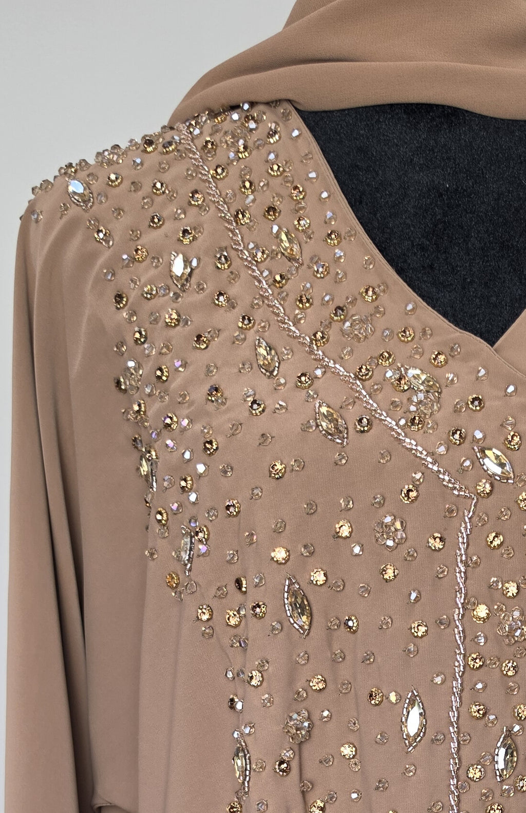 Dahab Abaya - close-up of gold glitter crystal front embellishment