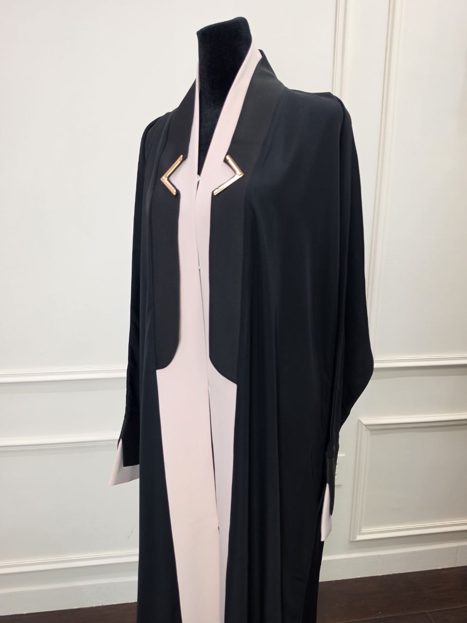 Maysoon Abaya - Black and beige angle view with gold-tone chest clasps