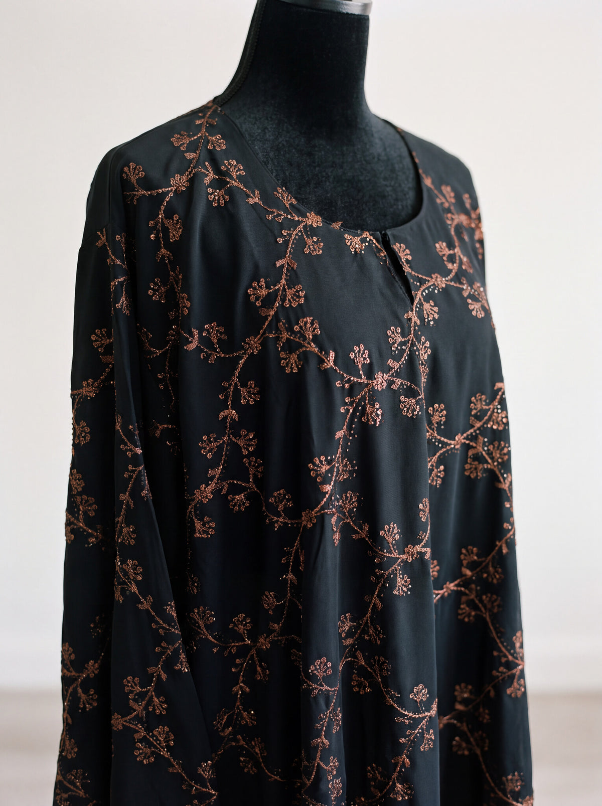 Midnight Vine Abaya - Bronze color angled view with matching hijab
