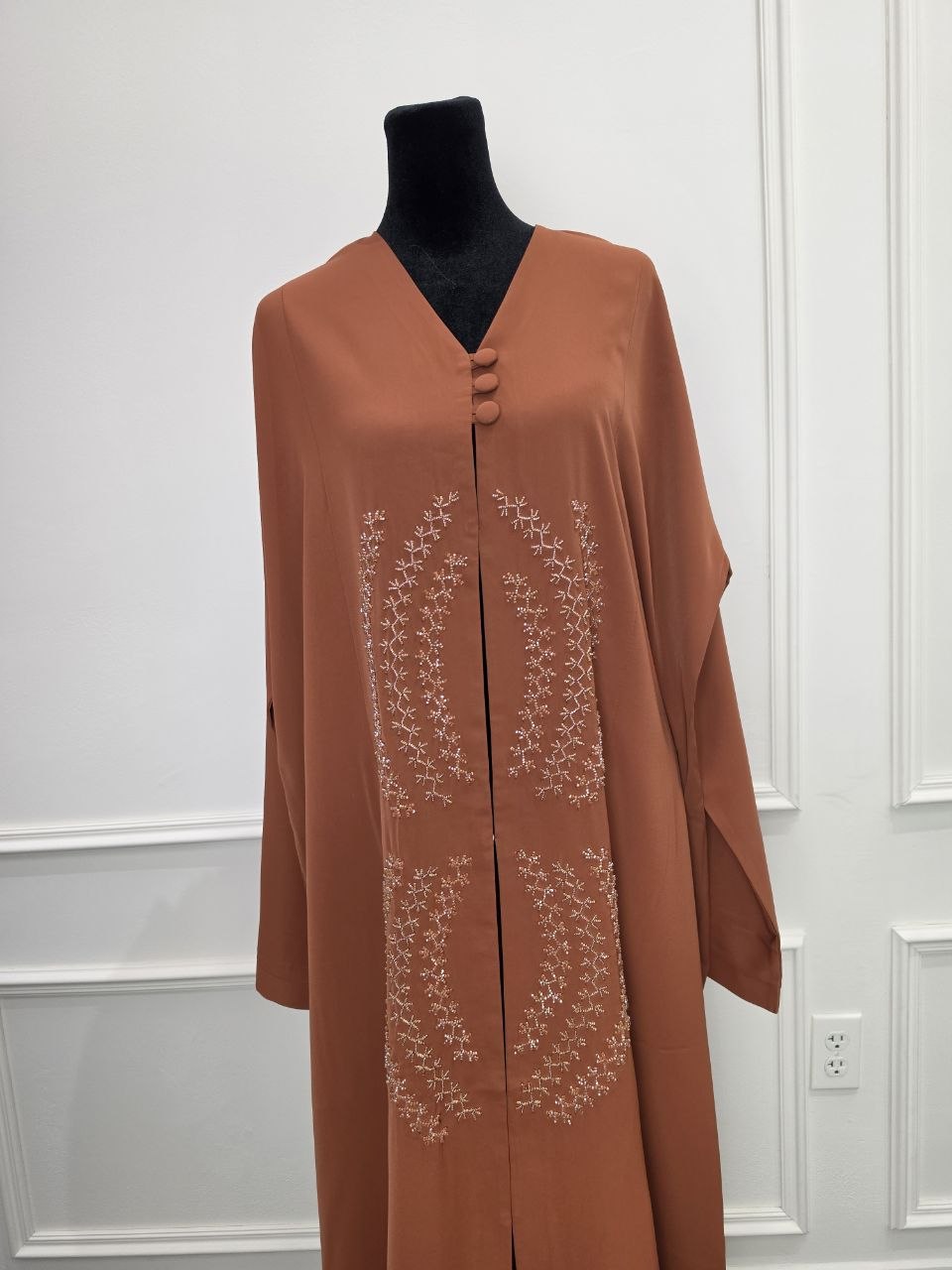 Sahara Abaya - desert rust close view of covered buttons and pearl embroidery