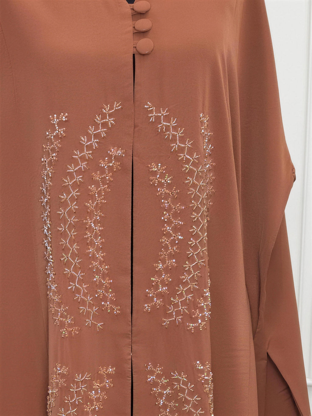 Sahara Abaya - desert rust close view of covered buttons and pearl embroidery
